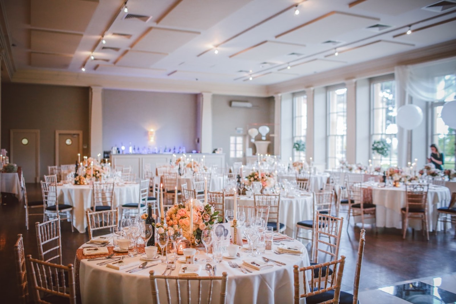 The Arboretum event room set with round tables and florals for a reception